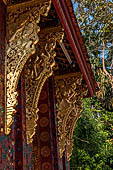 Wat Xieng Thong temple in Luang Prabang, Laos. the Ho Tai, the library. Detail of the console of the roof. 